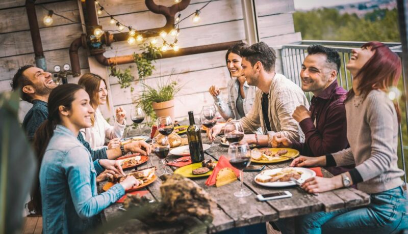 Young,People,Dining,And,Having,Fun,Drinking,Red,Wine,Together