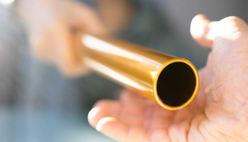 Hand,Passing,Golden,Relay,Baton,To,Businesswoman