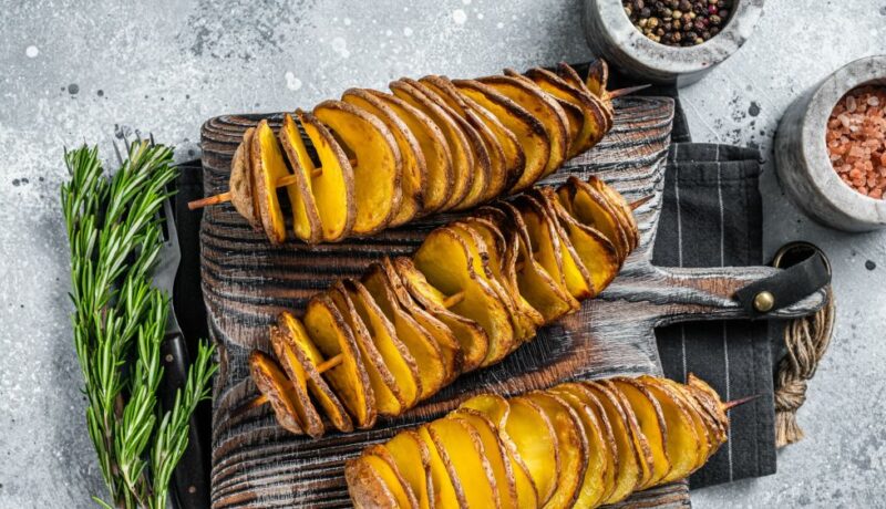 Crispy,Tornado,Or,Twist,Potatoes,Chips,On,Wooden,Board.,Gray