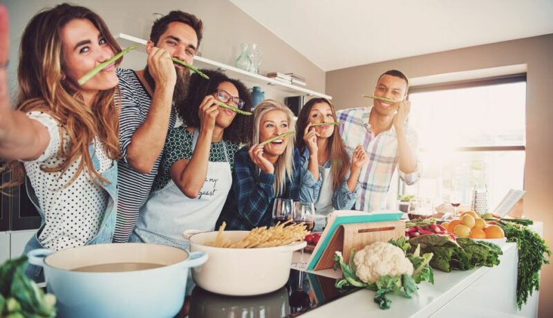 Friends,Wearing,Asparagus,Stalks,Under,Their,Noses,While,Standing,In